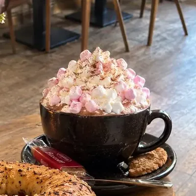 Hot chocolate topped with cream and marshmallows